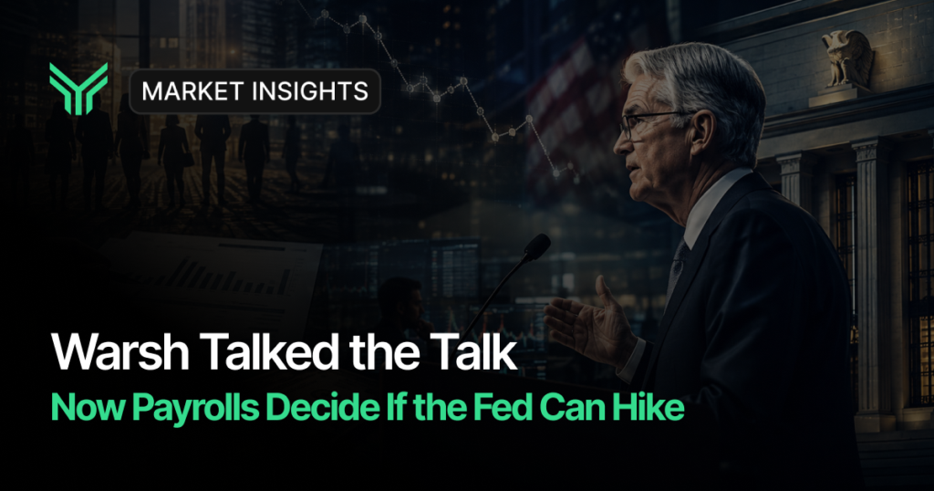 Market Insights blog cover with a dark financial backdrop of a descending chart line, an American flag, a classical bank facade and silhouetted figures in a city, alongside a gray haired man in glasses and a dark suit speaking into a microphone at a podium. Headline text reads "Warsh Talked the Talk" with a green subhead, "Now Payrolls Decide If the Fed Can Hike."